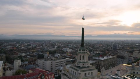 4K Bulgaria Flag Flys Over Sofia Bulgaria Drone Sunrise Downtown Red Green White