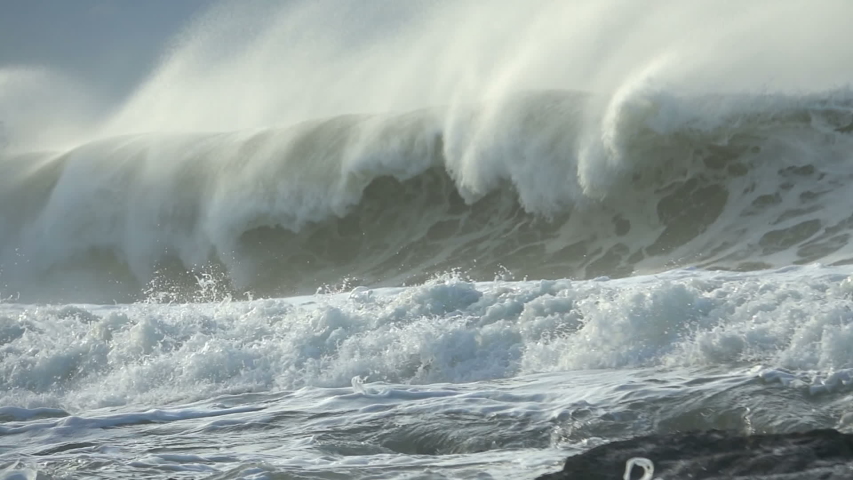 Extreme Ocean Wave crushing coast. Power of waves breaking splashing sea-spray water foam  | Shutterstock HD Video #1044601696