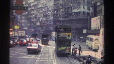 HONG KONG-1982: Congested Foreign City Traffic On Foot Buses And Cars At Intersection