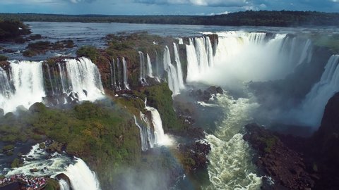 Aerial landscape of Iguazu waterfalls. Niagara waterfalls. Cataratas del Iguazu waterfall. Waterfalls nature scene. Rainbow water falls landscape. Aerial view of Cataratas do Iguaçu water fall stream