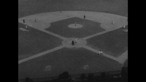 1940s: Baseball game. Pitcher throws ball. Batter hits ball and runs. Caption reads "JOHNNY VANDER MEER."