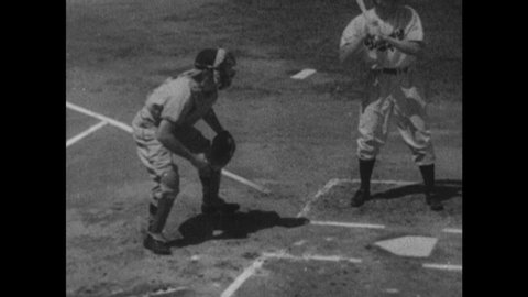 1940s: Baseball game. Batter hits ball and runs. Catcher takes off mask and catches pop fly. Catcher throws ball.