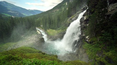 Amazing scenic view of Krimml Waterfall and valley with forest in Austria