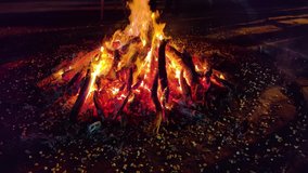 Gurgaon, India, Circa 2020 - Video of a giant bonfire lit for the auspicious festival of lohri or Holi or Holika Dahan. This is a spring harvest festival celebrated in India by roasting grain, popcorn