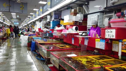 Busan, South Korea - January ,3, 2020: 
 Activity in the indoor fish market in 
 Jagalchi Market,The Korea's largest seafood market, selling both live and dried fish.