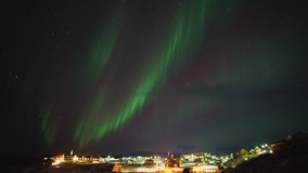 Aurora borealis on Ilulissat village, Greenland - Powered by Shutterstock - Get 15% off with code: PIKWIZARD15