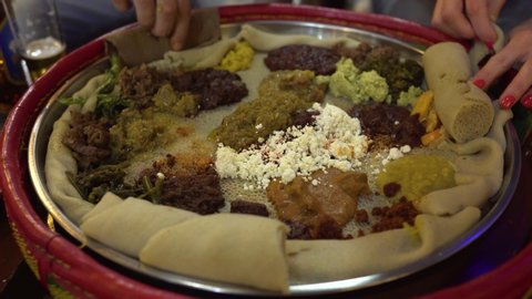 Ethiopian traditional meal eating, hands close up stock video. 