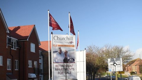 Littlehampton, West Sussex, UK, January, 15, 2020, Churchill Retirement Living Flags advertising a recent new development in Littlehampton.