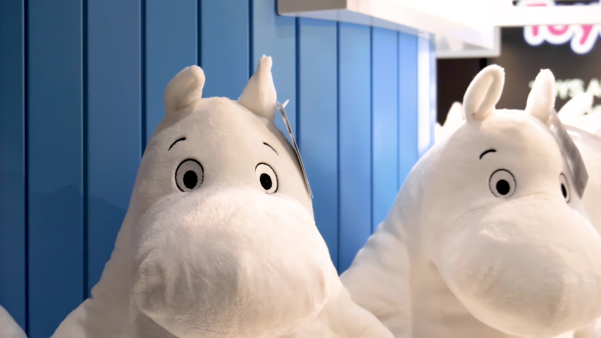 Two white hipp stuffed animals on the toy store with the tags in Moomin Finland