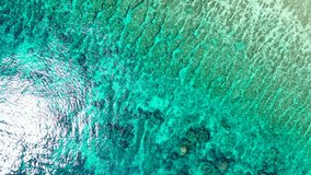 Clear Turquoise Sea With Rocks And Coral Reefs in Bermuda - Aerial Shot
