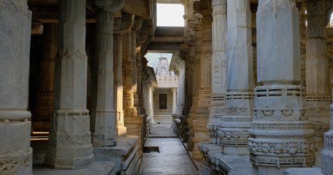 Interior of beautiful Ranakpur Jain temple or Chaturmukha Dharana Vihara. Marble ancient medieval carved sculpture carvings of sacred religious place of jainism worship. Ranakpur, Rajasthan. India