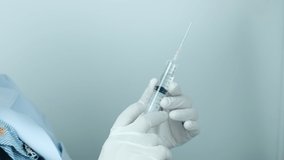 The doctor injects the drug into the needle to treat and prevent the virus for the patient in laboratory, medical and healthcare.Vaccination concept. Healthcare, hospital and medical diagnostics. - Powered by Shutterstock - Get 15% off with code: PIKWIZARD15
