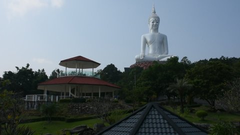 MUKDAHAN, THAILAND - OCTOBER 2 : Big white buddha statue in Wat Roi Phra Phutthabat Phu Manorom for traveler people visit and respect at Mukdahan National Park on October 2, 2019 in Mukdahan, Thailand