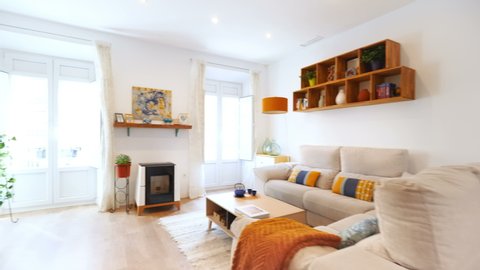 Malaga, Spain.Circa January 2020. Real estate virtual tour. Camera fly-through the interior of a cozy home. Scandinavian living room and salon.