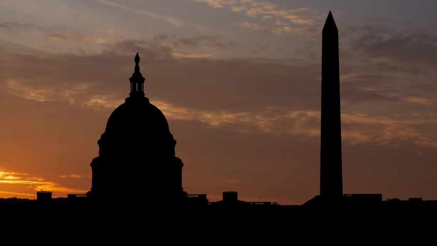 Washington DC: Capitol Building and Washington Monument at Sunrise, Time Lapse with Iconic Monuments in Silhouette Royalty-Free Stock Footage #1044727024