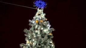 Closeup 4k video of glowing and blinking colorful led lights on Christmas tree against burning fireplace at night. Perfect shot for winter celebrations and holidays - Powered by Shutterstock - Get 15% off with code: PIKWIZARD15