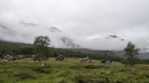 Cloudy day with mountains cabins