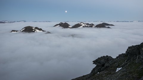 Moonset over mountain with inversion and planet Jupiter
