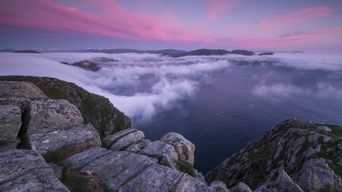 Red sky with inversion flowing over the coastline
