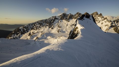 Winter mountains ridge at sunset
