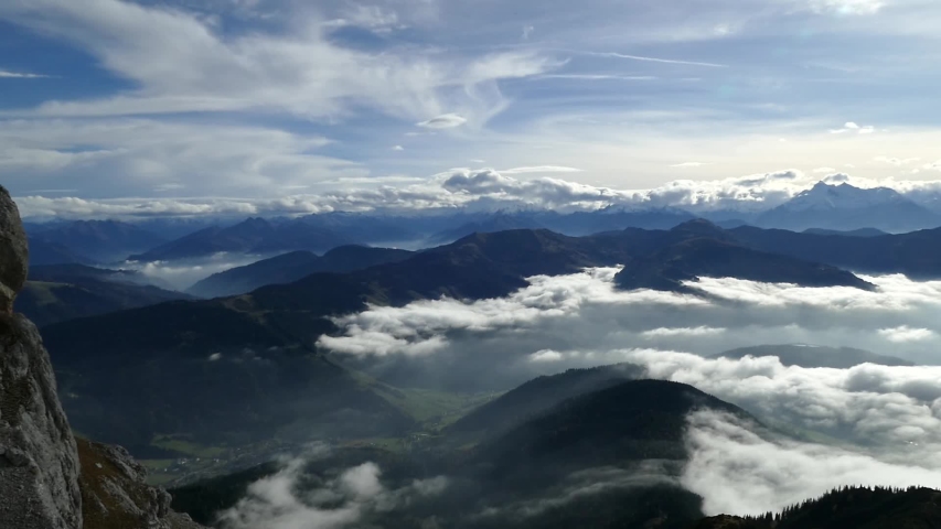 beautiful alpine landscape above the clouds