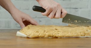 Woman cutting handmade pie on the table, close-up video