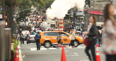 Manhattan, New York - September 19, 2019: Taxis, bikes and car traffic roll down Broadway at rush hour on the busy streets of downtown Manhattan New York City USA