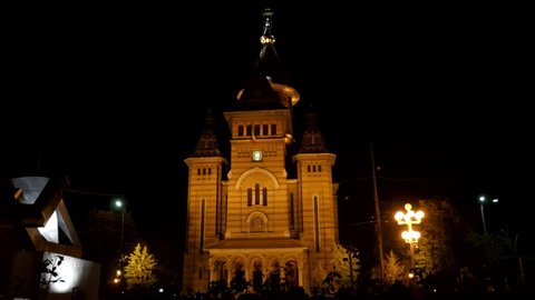 TIMISOARA, ROMANIA - OCTOBER 16 2019: Night scene in front of Metropolitan church in Timisoara Romania 4K tilting video