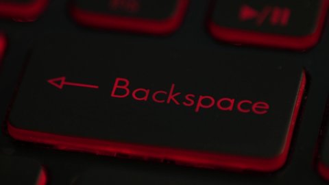 clicking finger pressing backspace button on keyboard computer multiple times