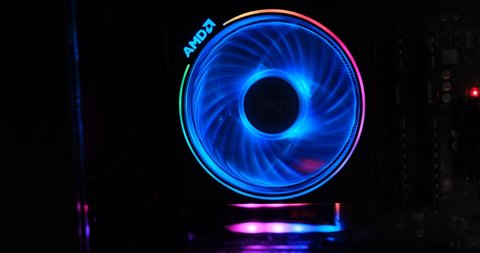 Athens, Greece - January 17, 2020: AMD Wraith Prism cooler with RGB lights powering on and spinning, at computer start up - close up.