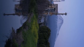 Mt. Fuji and a Factory Reflected in a River  (Vertical/Panning)