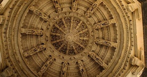 Ceiling of iconic Ranakpur Jain temple or Chaturmukha Dharana Vihara. Marble ancient medieval carved sculpture carvings of sacred religious place of jainism worship. Ranakpur, Rajasthan. India