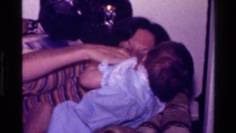 CALIFORNIA USA-1977: Footage Of Mother Nurturing Newborn Baby In What Appears To Be The Home