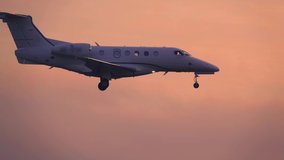 Business jet (private jet) landing at sunset. Side view - Powered by Shutterstock - Get 15% off with code: PIKWIZARD15
