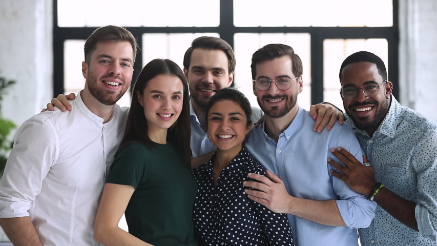 Happy confident professional diverse team business people bonding stand in office looking at camera, smiling multiethnic corporate staff group portrait, partnership and teamwork concept, slow motion | Shutterstock HD Video #1044846433