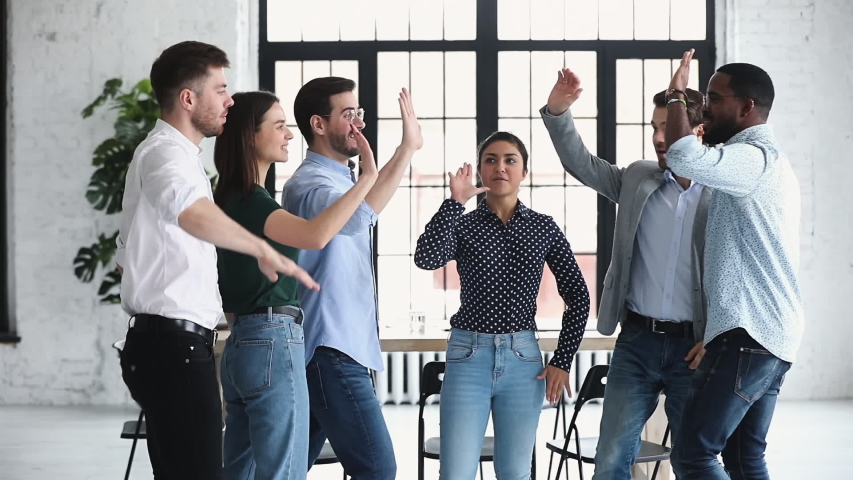 Happy diverse professional business office team give high five together in office, multiethnic coworkers group celebrate corporate success engaged in unity teamwork partnership concept, slow motion Royalty-Free Stock Footage #1044846448