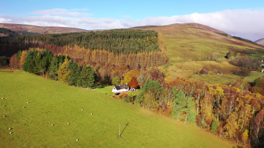 4K aerial drone footage over a farm croft cottage in the Highlands of Scotland, UK