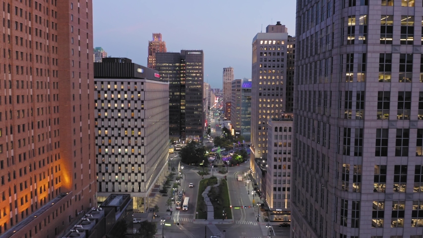 Aerial: Detroit city skyline and traffic at night. Detroit, Michigan, USA. 