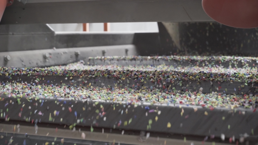 Plastic recycling factory, extruded plastic waste is processed in the plant, in support of the low environmental global impact Royalty-Free Stock Footage #1044888871