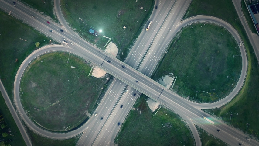 GPS navigation and autonomous driverless transportation concept. Aerial view of transport junction with cars and trucks driving with digital green circles, future global technology on roads Royalty-Free Stock Footage #1044892783