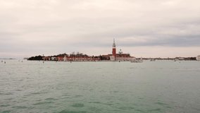 4K Video of Grand Canal with calm water and Island Of San Giorgio Maggiore In Venetian Lagoon, Venice, Italy. Famous touristic attraction and landmark