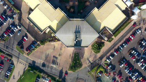 Aerial footage of a large shopping centre and car parks located in the city of Castleford in West Yorkshire England UK known as Junction 32 Yorkshire Outlet Shopping Village J32