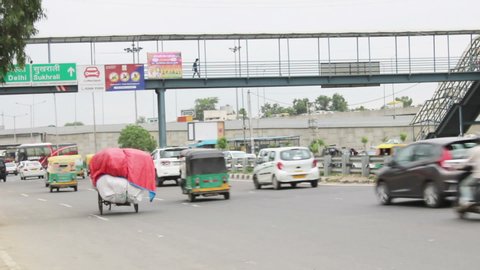 Iffco Chowk, Gurgaon/Gurugram, Haryana, India - July 25, 2019: Traffic Crossing Under pedestrian Flyover