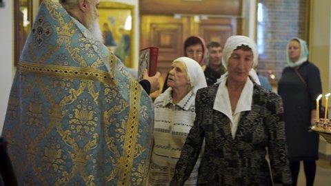 ZLATOUST, RUSSIA - 09/22/2019 "Temple of the Holy Righteous Simeon of Verkhotursky the Miracle Worker" Parishioners kiss the book one by one.