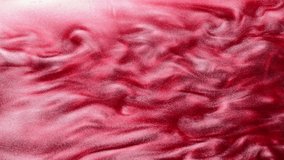 Glitter ink flow. Dragon breath. Shimmering pink red liquid blend overlay effect.