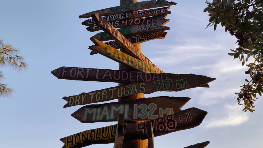 Signpost in Fort Zachary Taylor State Park, Key West, Florida at sunset, Wooden directional beach signs