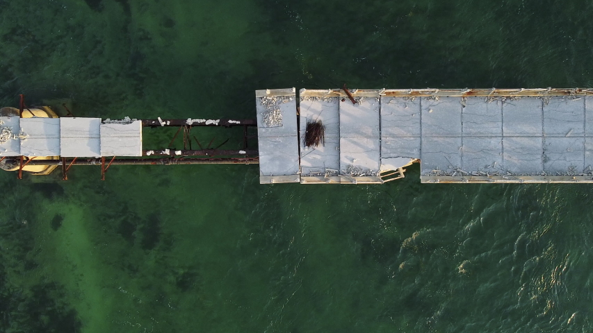 Aerial top shot of Bahia Honda Rail Bridge missing span at sunrise