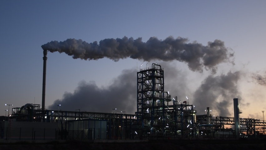 Chemical plant pumping out smoke and steam. Industrial air pollution and global warming | Shutterstock HD Video #1044938785
