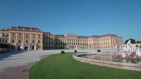 VIENNA AUSTRIA - JULY 11. 2019 wide steday shot of Schonbrunn / Schonbrunn Palace inner ward, inner yard with fountain and facade of Schonbrunn Palace building, no sound