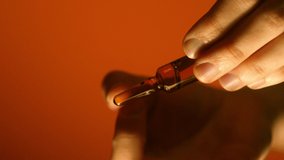 Scientist man keep brown ampoule in hand. Pharmaceutical business. Healthcare concept. Copy space. Vertical orientation video - Powered by Shutterstock - Get 15% off with code: PIKWIZARD15